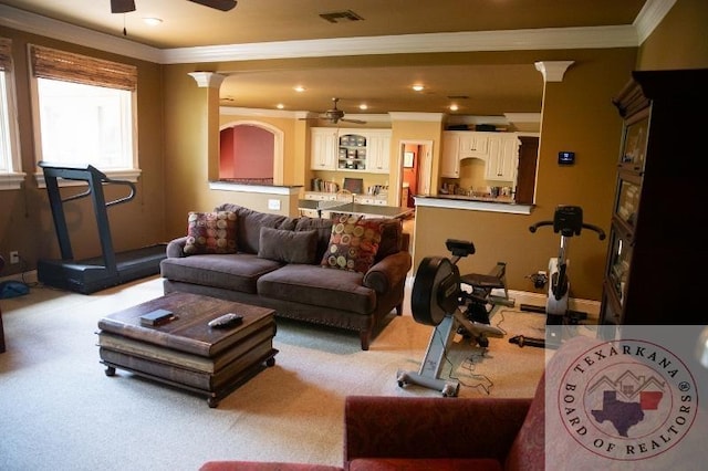 living room featuring ornamental molding, ceiling fan, and ornate columns