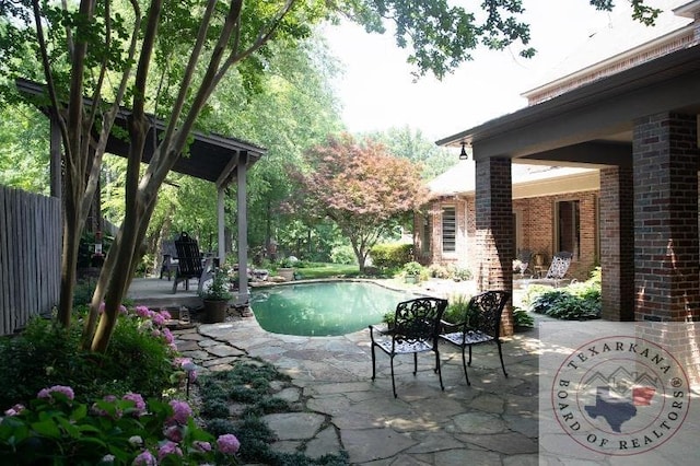 view of pool featuring a patio area