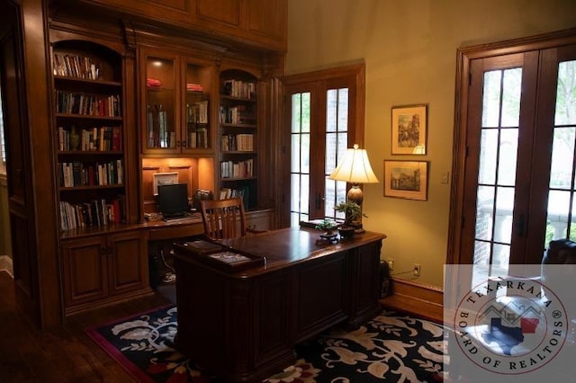 office area featuring plenty of natural light and dark hardwood / wood-style flooring