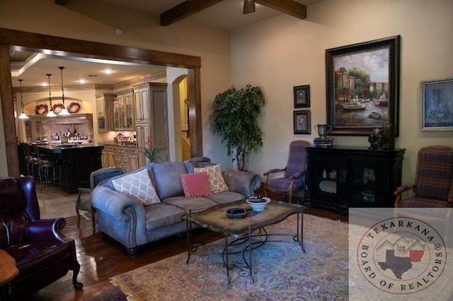 living room with hardwood / wood-style floors and beam ceiling