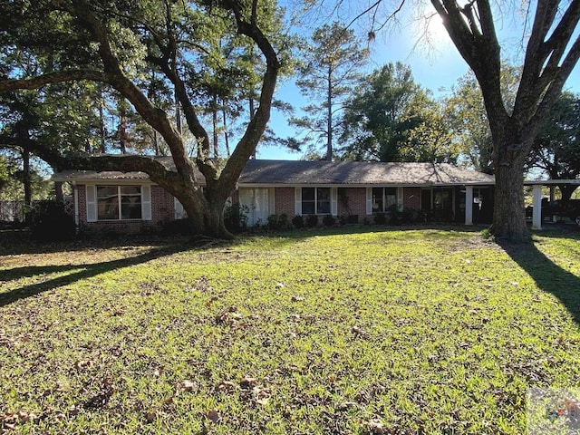 ranch-style house with a front lawn