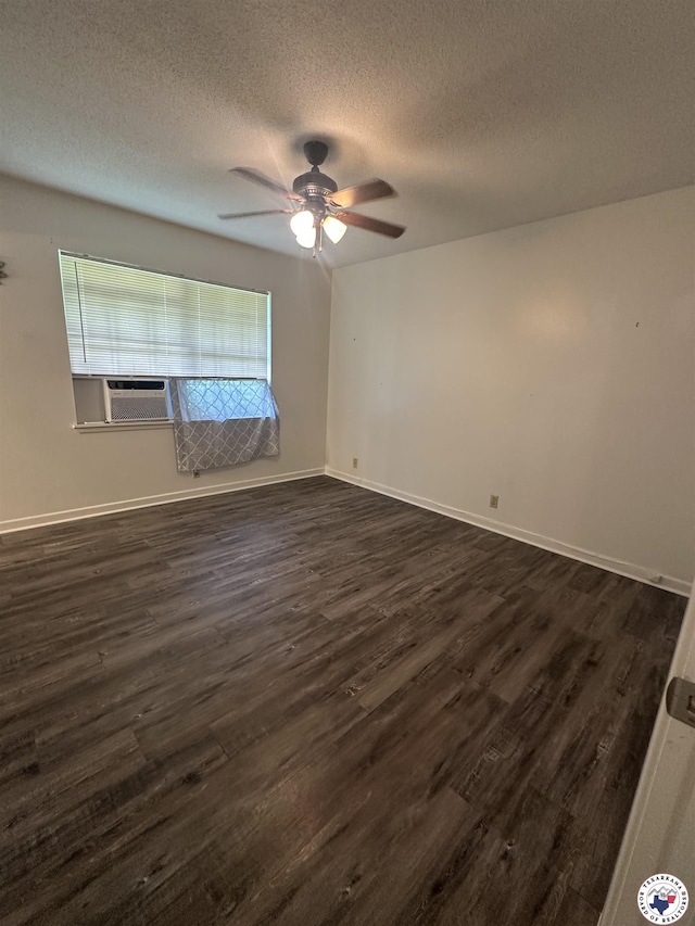 29 E Greenfield Dr, Wake Village, TX 75501 - spare room featuring dark wood-style floors, ceiling fan, a textured ceiling, cooling unit, and baseboards
