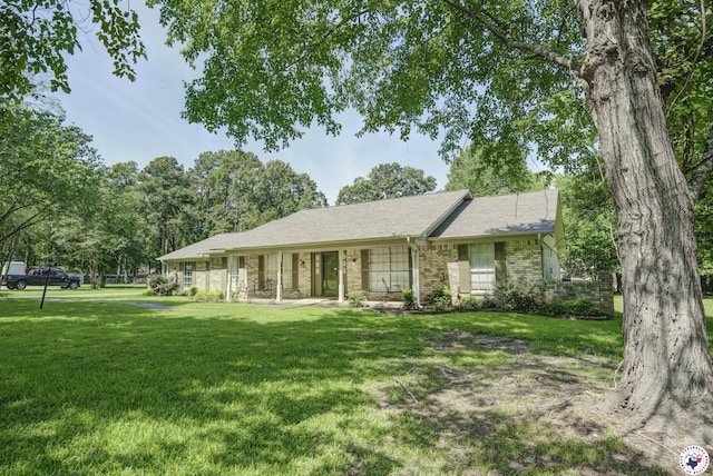 13 Holly Ridge Dr, Texarkana, TX 75503 - ranch-style house featuring a front lawn, brick siding, and a shingled roof