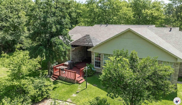 13 Holly Ridge Dr, Texarkana, TX 75503 - back of property featuring a wooden deck, a lawn, and a shingled roof