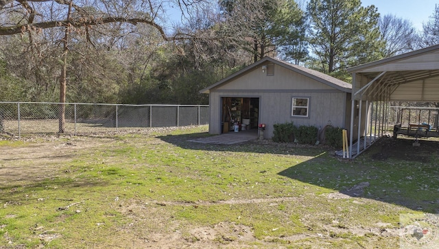 view of yard with a carport and an outdoor structure