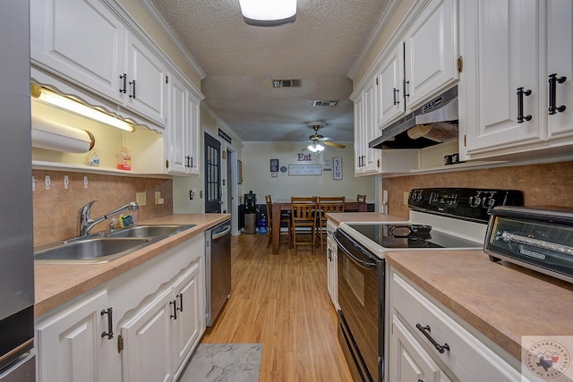 kitchen with a textured ceiling, dishwasher, white cabinetry, range with electric cooktop, and sink