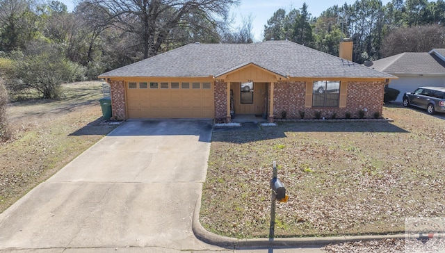 ranch-style house featuring a garage