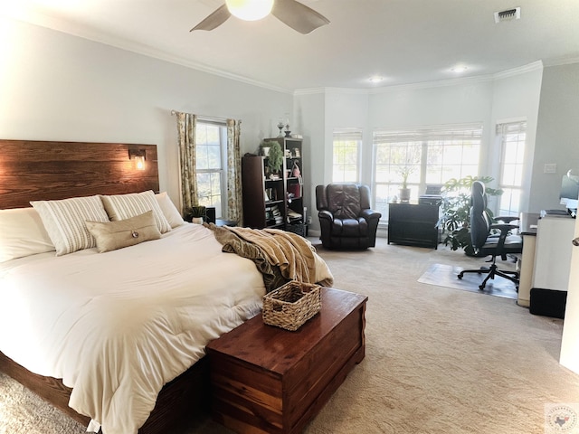 carpeted bedroom featuring ceiling fan, ornamental molding, and multiple windows