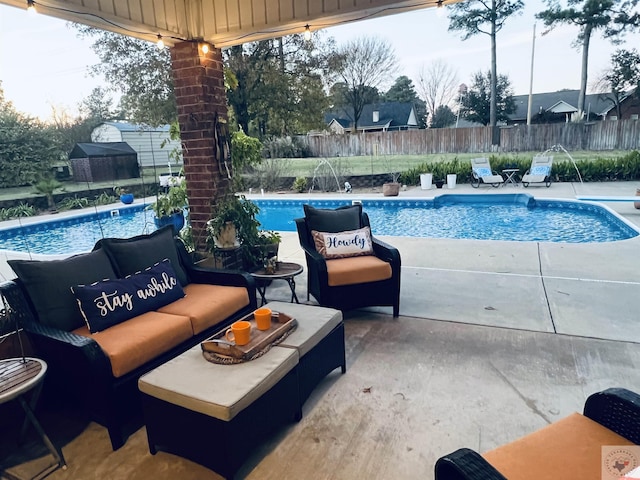 view of swimming pool featuring a patio area and pool water feature