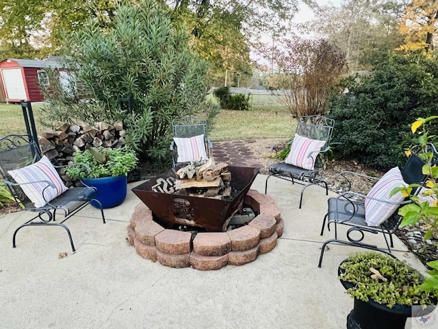 view of patio featuring an outdoor fire pit