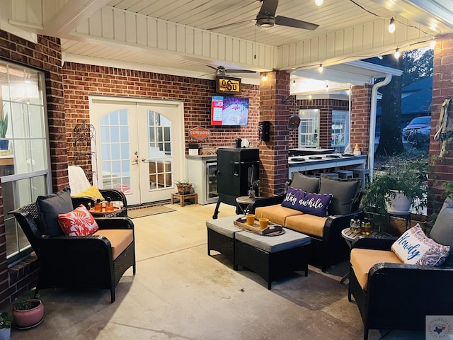 view of patio with an outdoor living space, ceiling fan, and french doors