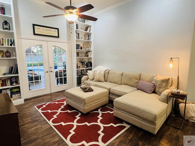 living room with ceiling fan, dark hardwood / wood-style flooring, crown molding, and french doors