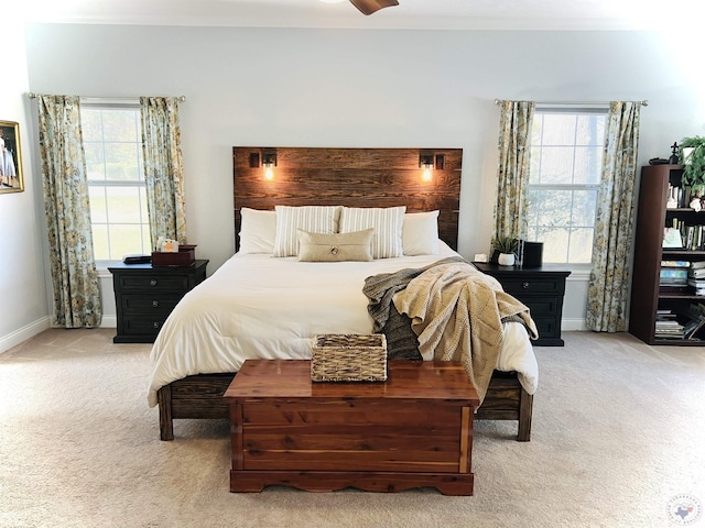 bedroom featuring ceiling fan and light colored carpet