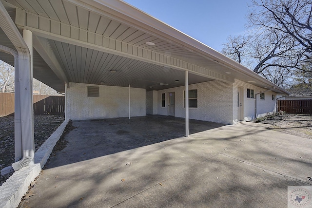 exterior space with a carport