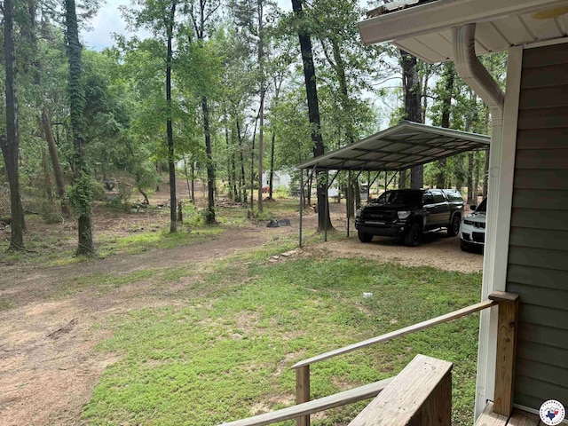 5440 Calico Duck Rd, Texarkana, AR 71854 - view of yard with a carport and driveway