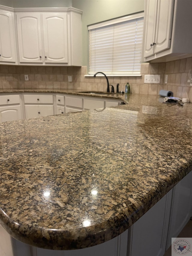 7311 Shilling Cir, Texarkana, TX 75503 - kitchen featuring a sink, white cabinets, and dark stone countertops