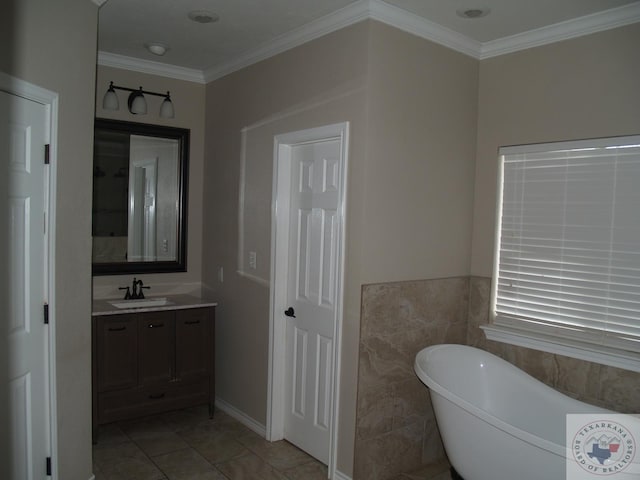 7311 Shilling Cir, Texarkana, TX 75503 - full bathroom with a freestanding tub, vanity, crown molding, and tile patterned floors