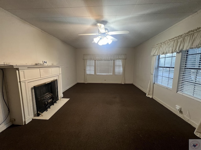 unfurnished living room featuring dark colored carpet and ceiling fan