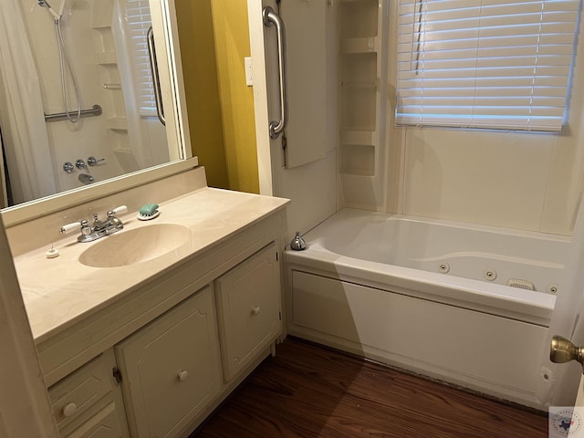 bathroom featuring shower / bathtub combination, wood-type flooring, and vanity