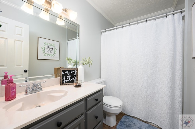 bathroom featuring a textured ceiling, toilet, vanity, and ornamental molding