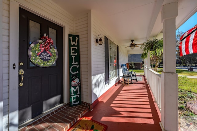 entrance to property with ceiling fan