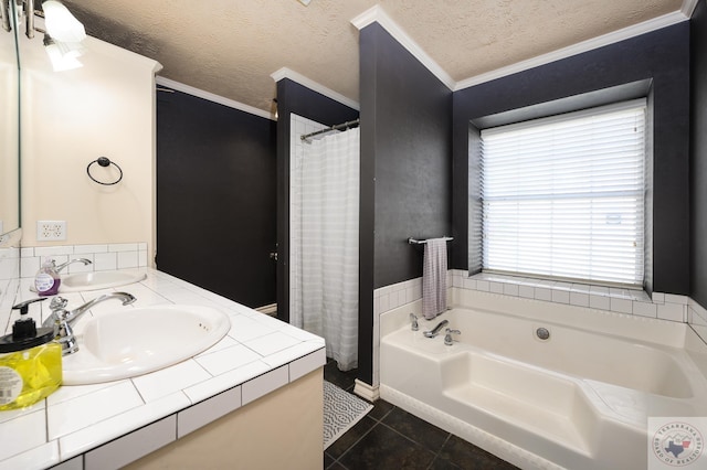 bathroom featuring crown molding, tile patterned floors, a bathtub, a textured ceiling, and vanity