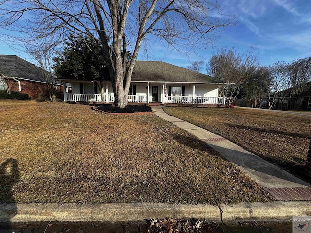 ranch-style house with a front lawn and a porch