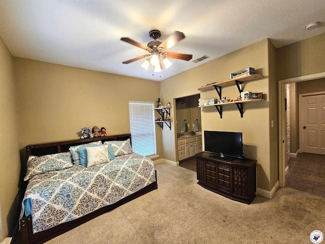 carpeted bedroom with baseboards, visible vents, and ceiling fan