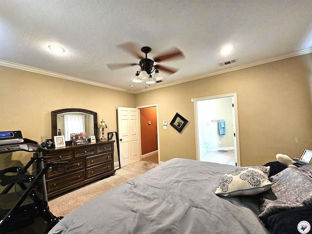 bedroom featuring visible vents, connected bathroom, crown molding, and light colored carpet
