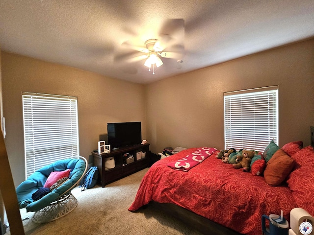 bedroom with ceiling fan and light colored carpet