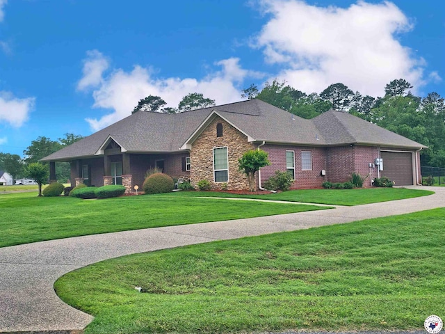 ranch-style home featuring an attached garage, driveway, stone siding, and a front yard