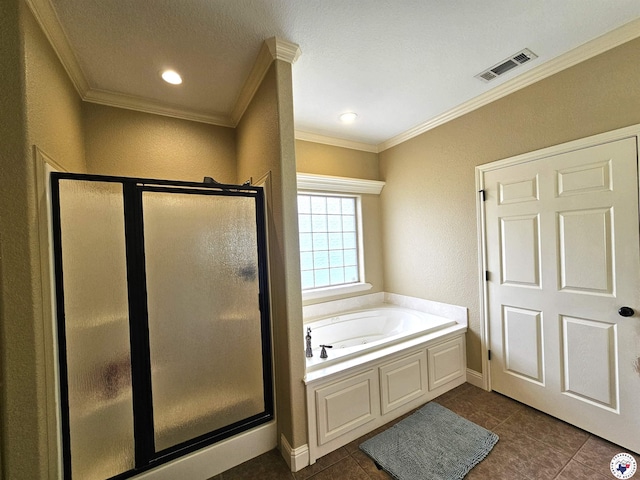 bathroom with tile patterned floors, visible vents, ornamental molding, a garden tub, and a stall shower