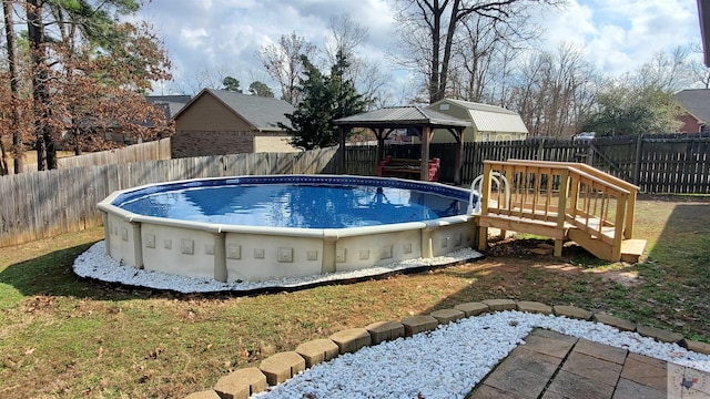 view of pool featuring a gazebo and a lawn