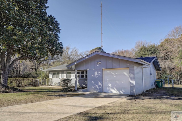 exterior space with a garage and a front yard