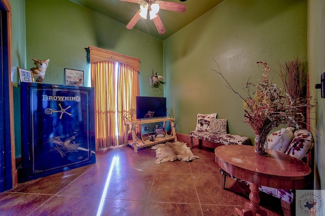 living area with ceiling fan