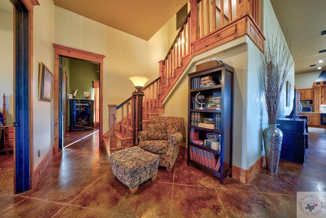 sitting room with a high ceiling