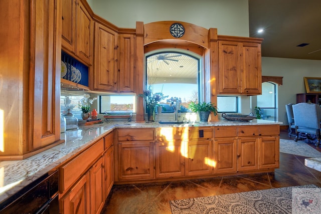 kitchen with sink and light stone countertops