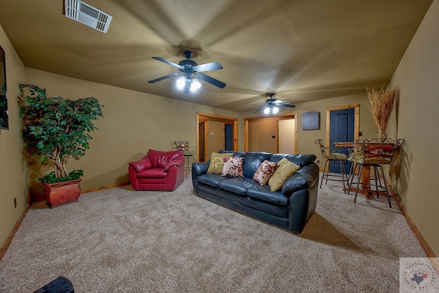 living room featuring ceiling fan and carpet