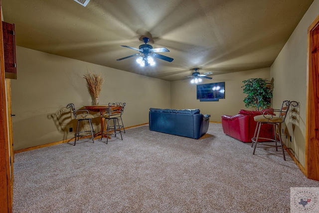 carpeted living room featuring ceiling fan