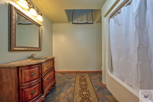 bathroom with shower / bath combo with shower curtain and vanity