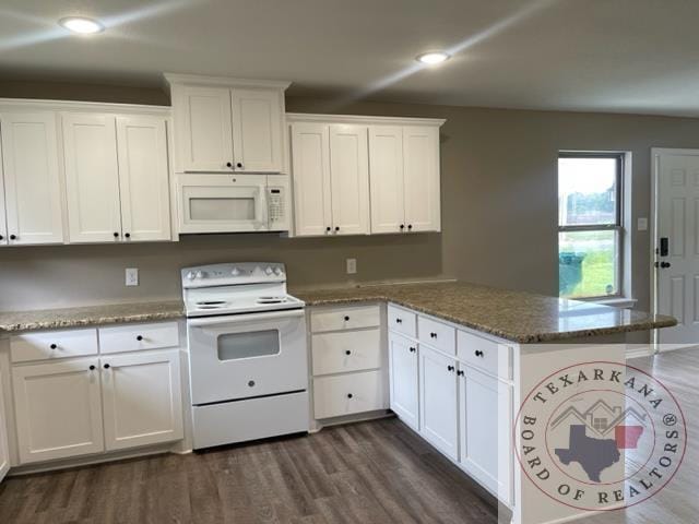 kitchen featuring white appliances, white cabinets, and dark hardwood / wood-style flooring