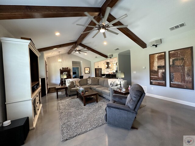 living room featuring concrete floors and vaulted ceiling with beams