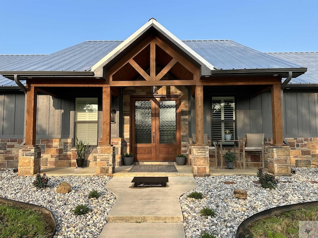 property entrance with french doors and a porch