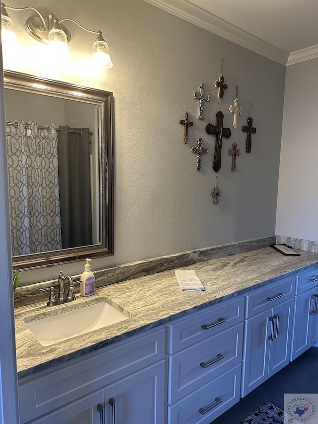 bathroom with vanity and crown molding