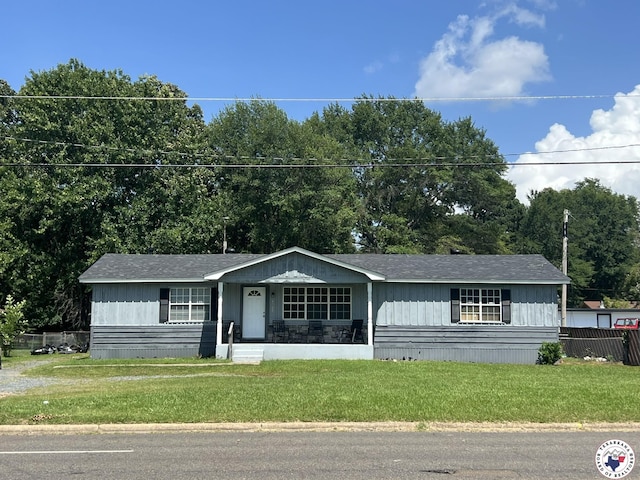 4320 Jefferson Ave, Texarkana, AR 71854 - view of front facade with a front lawn, a shingled roof, and a porch