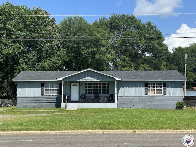 4320 Jefferson Ave, Texarkana, AR 71854 - view of front of property with a front lawn, covered porch, and roof with shingles