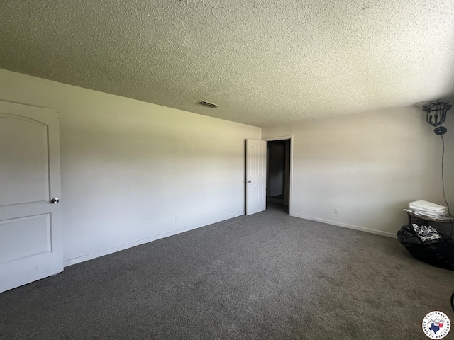 4320 Jefferson Ave, Texarkana, AR 71854 - unfurnished bedroom featuring dark colored carpet and a textured ceiling