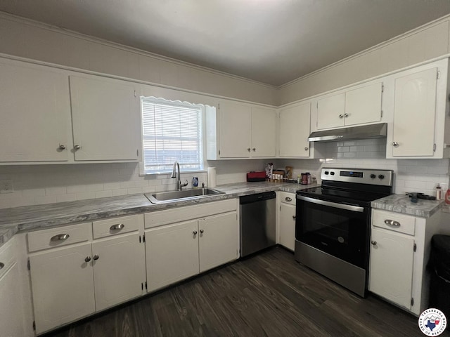 4320 Jefferson Ave, Texarkana, AR 71854 - kitchen featuring appliances with stainless steel finishes, under cabinet range hood, dark wood-style floors, white cabinets, and crown molding