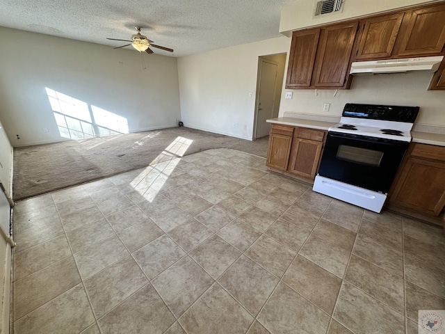 kitchen with light carpet, a textured ceiling, ceiling fan, and black / electric stove