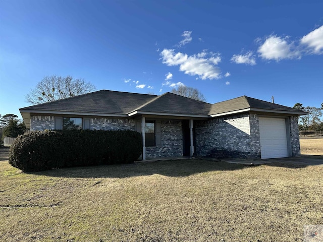 view of front of home with a garage and a front yard